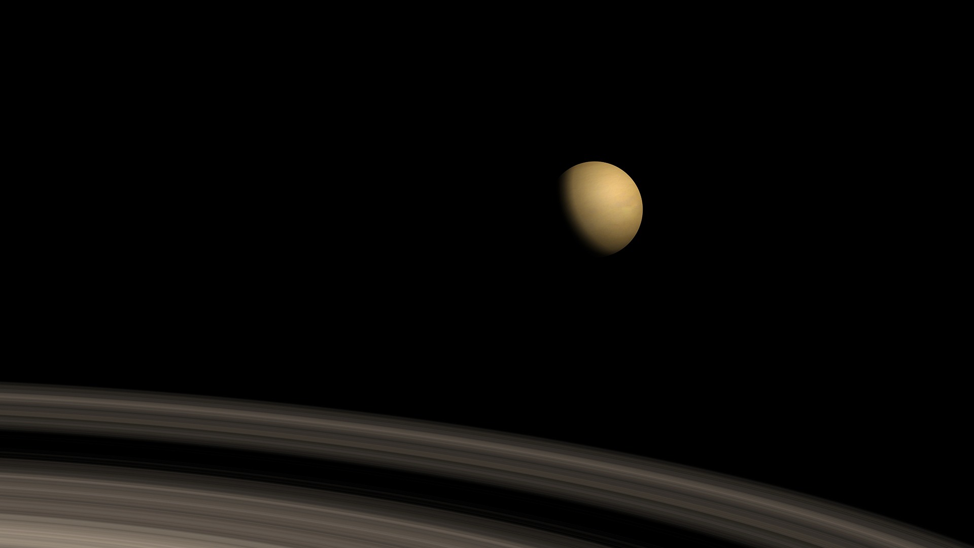 Saturnus ringar och dess måne.